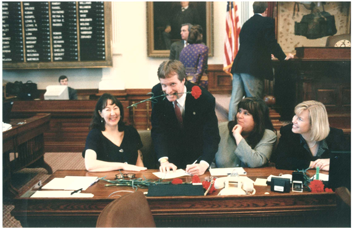 Elena Castaldi, Representative Terry Keel, Julia Bass and Marie Stafford at the Journal Clerk's desk, 75th Legislature, 1997. Photo courtesy of Terry Keel