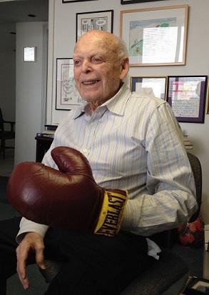 A.R. 'Babe' Schwartz wears a boxing glove given to him by Lt. Governor Hobby.