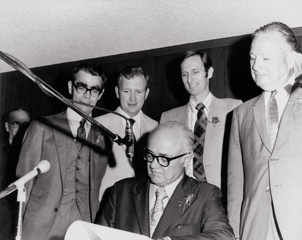 The signing of HB 762, 62nd R.S. Standing behind Gov. Preston Smith, L-R  Billy Williamson, Bill Bass, Ed Howard, Lindley Beckworth. Photo courtesy of the family of Billy H. Williamson.
