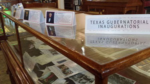 A photo of the library's new exhibit featuring Texas gubernatorial inaugurations.